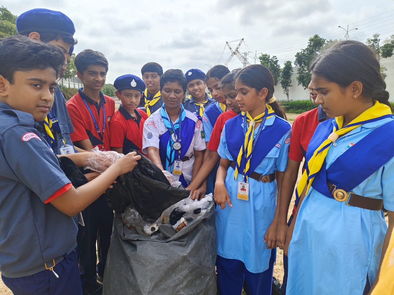 Meru Students in patrols collecting waste during Swachh Bharat activity on school campus.