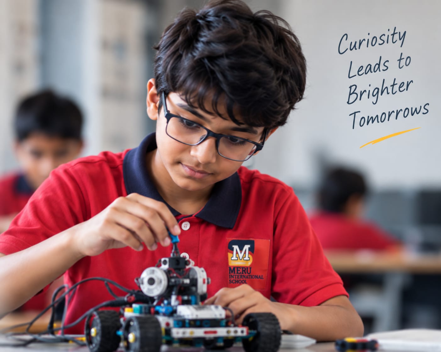 Student exploring robotics through hands-on building at Meru